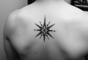 A star tattoo design. . black and white. small tattoo idea