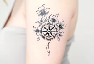 Abstract Compass with large flowers flowing above and below the compass tattoo idea