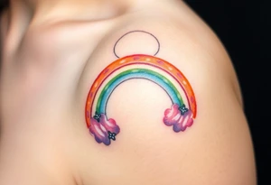 A rainbow with a halo above it to honour a rainbow baby tattoo idea