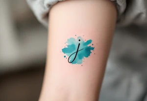 Minimalist thin-line "J" in crisp black, floating above a soft watercolor teal splash. tattoo idea