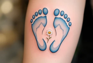 Light blue and soft gray footprints of Jakub, encircled by a small, blooming daisy to signify his pure and gentle spirit. tattoo idea