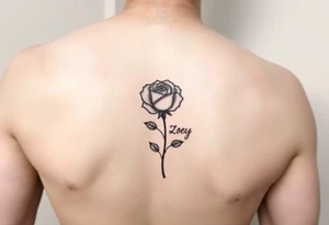 Arm tattoo with a rose and the name Zoey in cursive for the stem tattoo idea