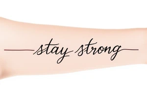 “Stay strong” in bold black script wrapped with a dark red heartbeat line. tattoo idea