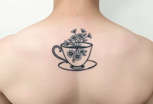 Dainty tea cup with small flowers tattoo idea