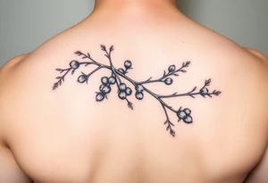 a rowan tree branch with berries and florals tattoo idea