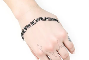 Chains intertwined around wrist going up to the thumb and index finger and connecting tattoo idea