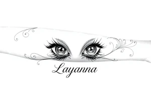 Baby eyes with the name layanna at the bottom of it tattoo idea