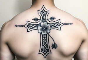 a celtic cross with irish inspired details and a four leaf clover adding other celtic elements surrounding the cross tattoo idea