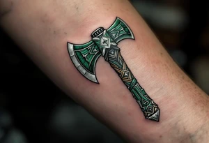 A dark green Perun's axe tattoo with carved wooden textures and silver highlights, symbolizing strength and masculine protection. tattoo idea