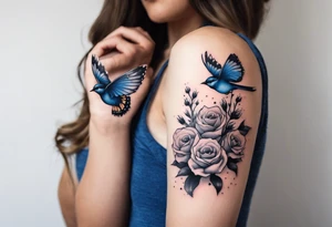 Rocky mountains with mountain blue birds and monarch butterflies with wild prairie roses  for a half sleeve tattoo idea