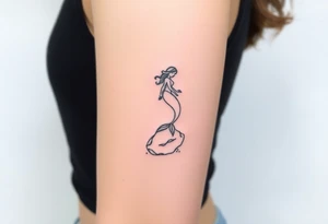 mermaid above water sitting on rock tattoo idea