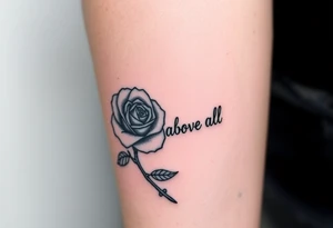 rose tattoo with thorns saying rise above all tattoo idea