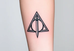 deathly hallows symbol from harry potter with the gryffindor sword in the middle tattoo idea