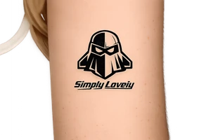 Create a 5 × 5 cm black ink tattoo combining the Koenigsegg Ghost logo, inspired by the Swedish flying squadron tribute, with the phrase **“Simply Lovely”** written underneath.

Make the ghost logo sharp, bold, and slightly aggressive, with a sleek hypercar and Formula 1 racing aesthetic. Use thick black outlines, clean geometric details, and a compact vertical composition. Below the ghost, add “Simply Lovely” in a bold italic racing font, similar to a motorsport team slogan.

Minimalist but powerful. Black and white only. No background, no extra logos, no flags, no car illustration. Professional tattoo stencil, crisp lines, highly readable text, designed for a small 5 × 5 cm tattoo. tattoo idea