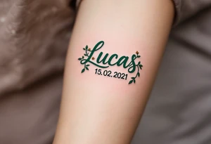 Name Luky 15. 02. 2021 – Deep emerald green vine twisting around Lucas's birthdate, with small yellow blooms dotting the numbers. tattoo idea