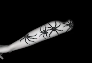 4 Spiders crawling down arm tattoo idea
