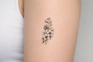 Cascading simple Irish flowers tattoo idea