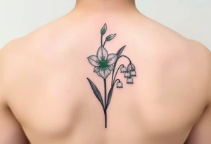 Upper arm tattoo. Peridot green Gladiola in the middle of two lily of the valley each with nine blossoms tattoo idea