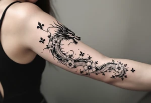 un dragon central entouré de fleurs de lys tattoo idea