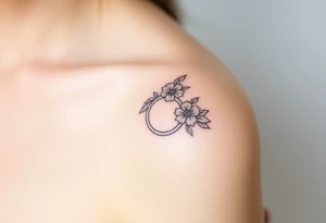 wedding ring tattoo with flowers tattoo idea