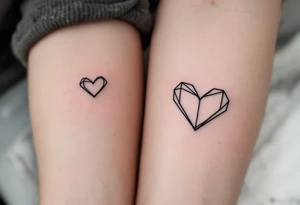 Matching minimalist black line heart tattoos symbolize the eternal bond between father and child. tattoo idea