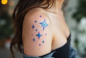 Watercolor-style Capricorn stars in soft blues and purples, fading like a cosmic dream across the shoulder. tattoo idea