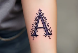 A stitched "A" design in dark purple and black, resembling embroidery. tattoo idea