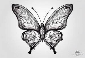 A lower back butterfly tatoo with the name nick below the butterfly tattoo idea