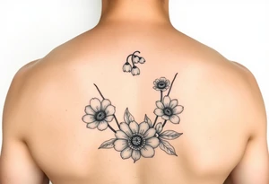 small lily of the valley, marigold, and chrysanthemum tattoo idea