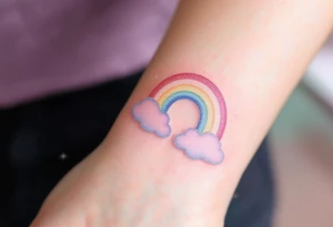 A pastel rainbow "S" with a glitter effect and soft cloud outlines. tattoo idea