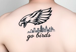 Philadelphia Eagle classic logo flying over Philadelphia city skyline with the words go Birds under it on bicep tattoo idea