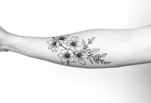 starting from a band mid forearm, narcissus flowers and holly flowers going up the arm tattoo idea