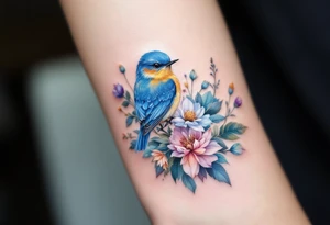 Puffy bluebird surrounded by wild flowers tattoo idea