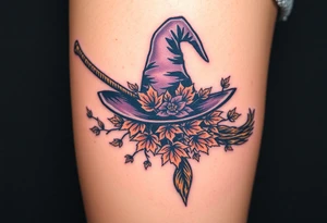 Which is broom with handle
 a witches hat with fall maple leaves and vines tattoo idea
