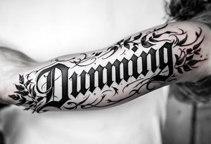 Dunning,on left arm details include angel wing, greek type of font,jungle leaves , tiger claw scratch tattoo idea