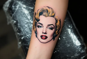 A minimalist outline of Marilyn’s face with golden hair accents and cherry red lips. tattoo idea