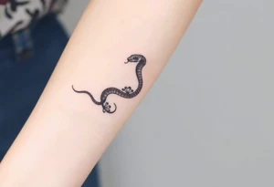 I want a small simple silhouette lines black and white wrist princess like royal snake tattoo that has number 12821 on its body along and also I want it to represent feminine energy crown queen Cycle tattoo idea