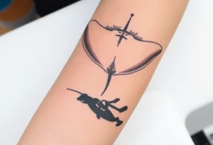 Manta ray silhouette above, scuba diver underneath, water background tattoo idea