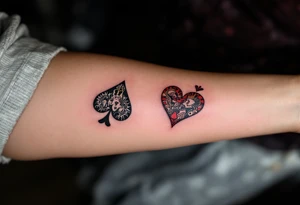 Two playing card symbols—King of Spades and Queen of Hearts—done in black, red, and subtle shading. tattoo idea