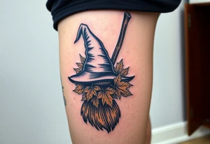 Which is broom with handle
 a witches hat with fall maple leaves tattoo idea
