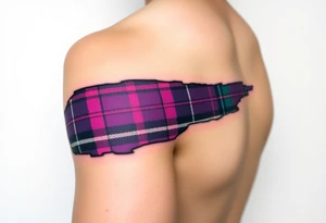 Dark Purple with green pink blue and white highlights tartan fabric on bicep with skin shedding away to reveal tartan underneath tattoo idea