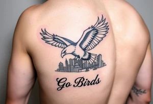 On upper bicep 
Philadelphia Eagle classic bird flying over Philadelphia city skyline with the words Go Birds under it tattoo idea