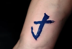 Brushstroke-style "J" in deep indigo, resembling Japanese ink calligraphy. tattoo idea
