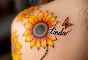 A vibrant sunflower in shades of yellow and orange with the daughter’s name Linda curved along the stem in black script. tattoo idea