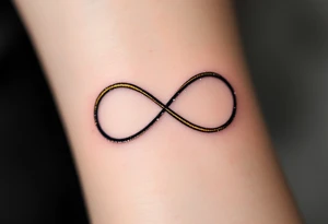 A thin, minimalist infinity outline in black gold, with tiny white sparkles accenting the curves. tattoo idea