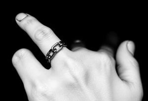 Chains wrapped on pointer finger and connected to thumb from my wrist showing whole hand tattoo idea