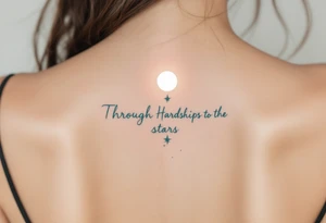 Flowing in teal ink across the spine, “Through Hardships to the stars” is crowned with a glowing white moon. tattoo idea