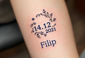 Calendar icon with highlighted date 14.12.2021 and the name "Filip" in royal blue below. tattoo idea
