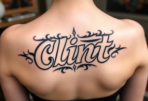 Clint spelled out in cartoon lettering tattoo idea