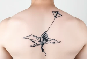 Kite in the country hand holding a kite. Over the hills tattoo idea